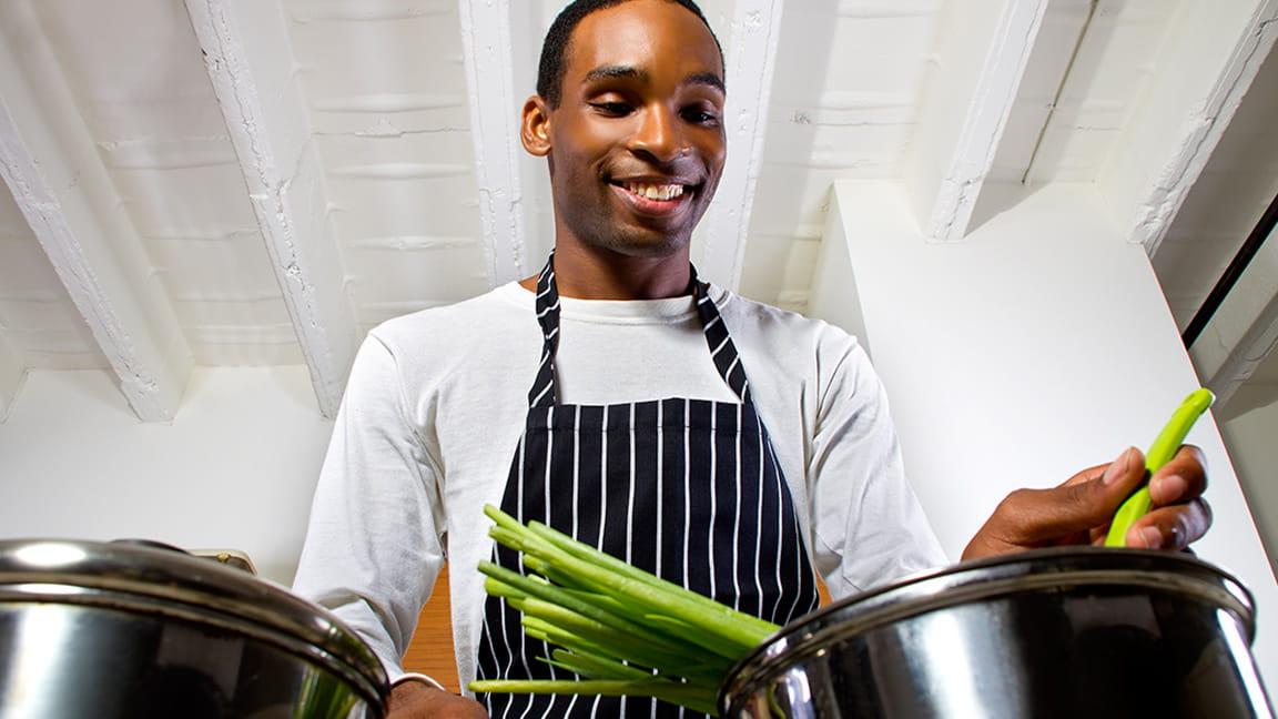 man cooking healthy