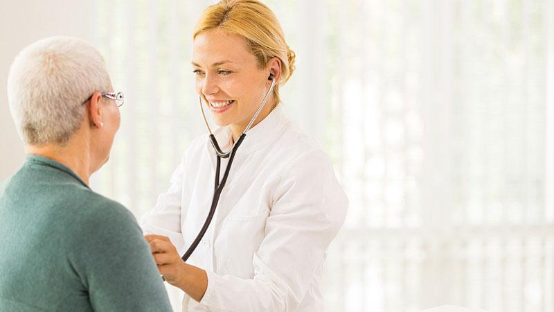 doctor listening to patient's heart