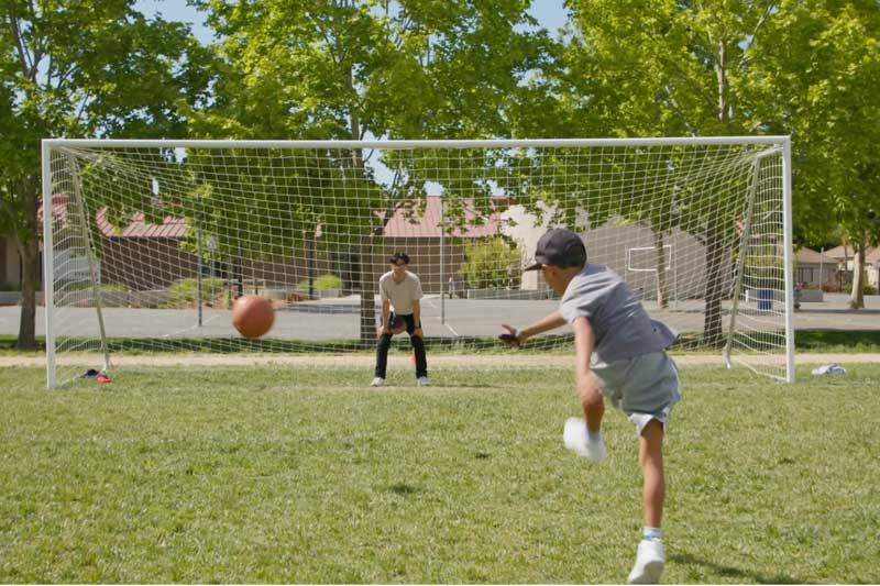 Luke kicking a soccer ball