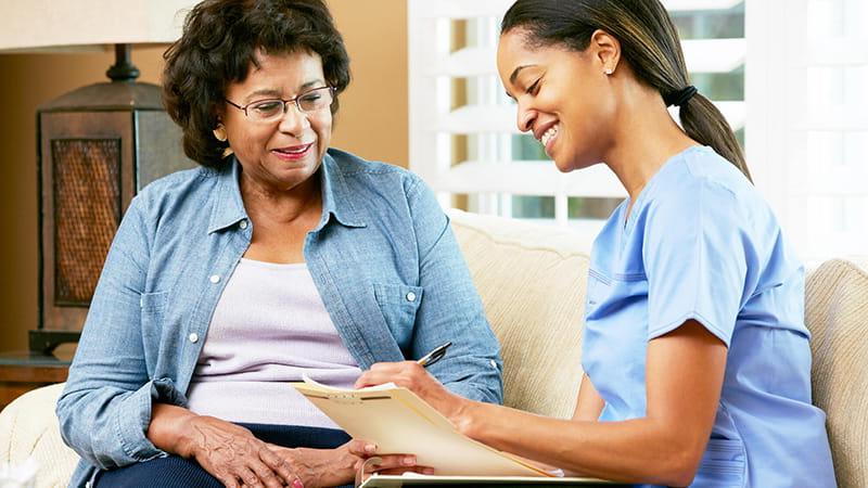 nurse giving instructions to patient